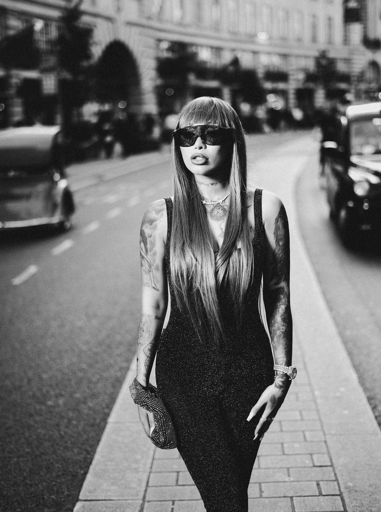 B&W street fashion portrait captured by Fred Art Studio on Oxford Street, London.