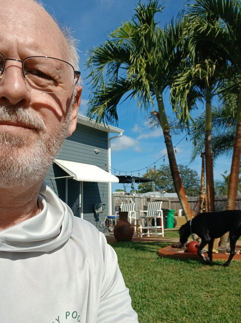 Robert at a dog check-in watching a large dog