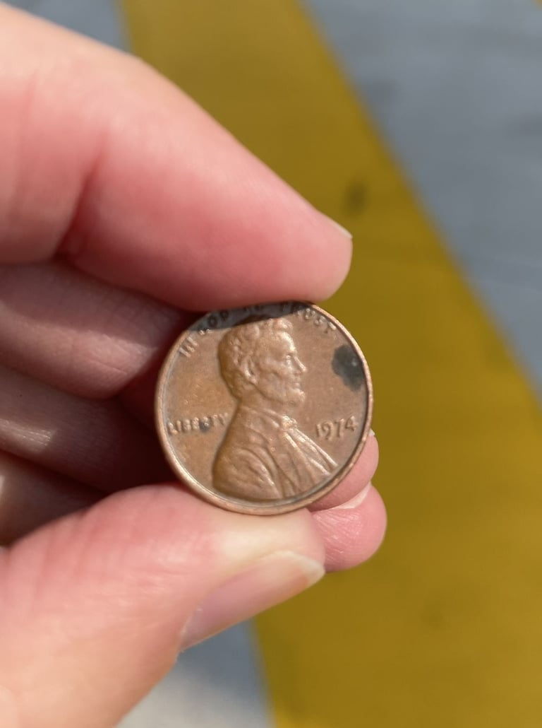 a person holding a penny penny penny penny penny penny penny penny penny penny penny penny