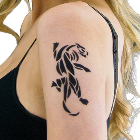 a woman with a tattoo on her arm