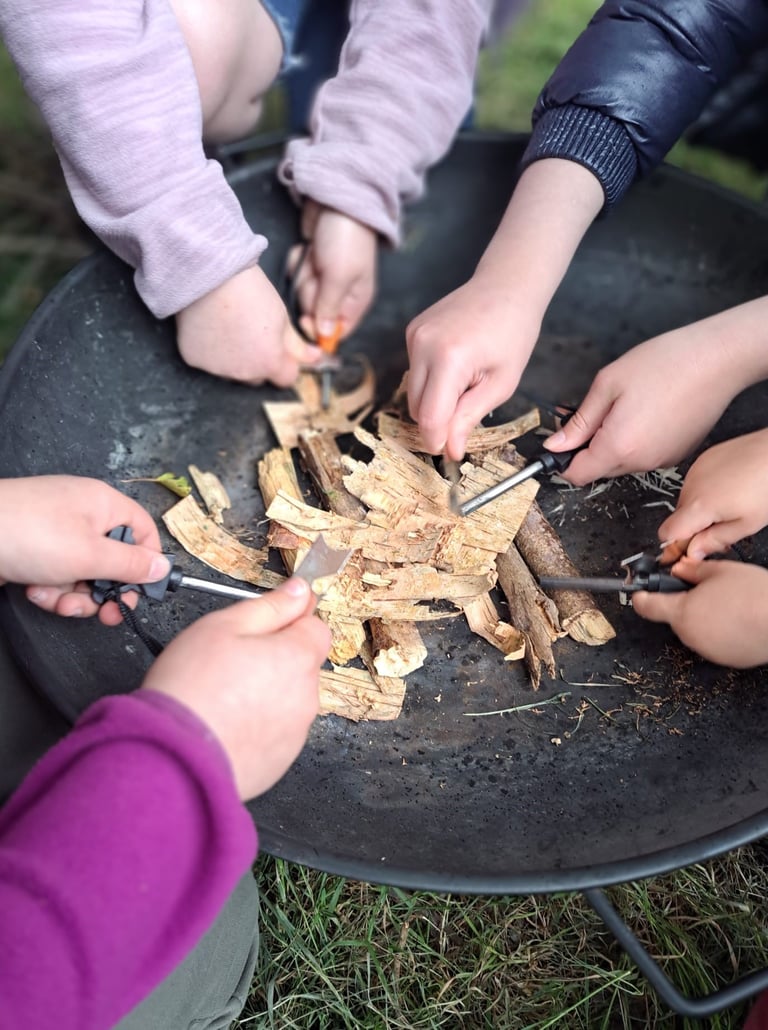 children lighting a fire