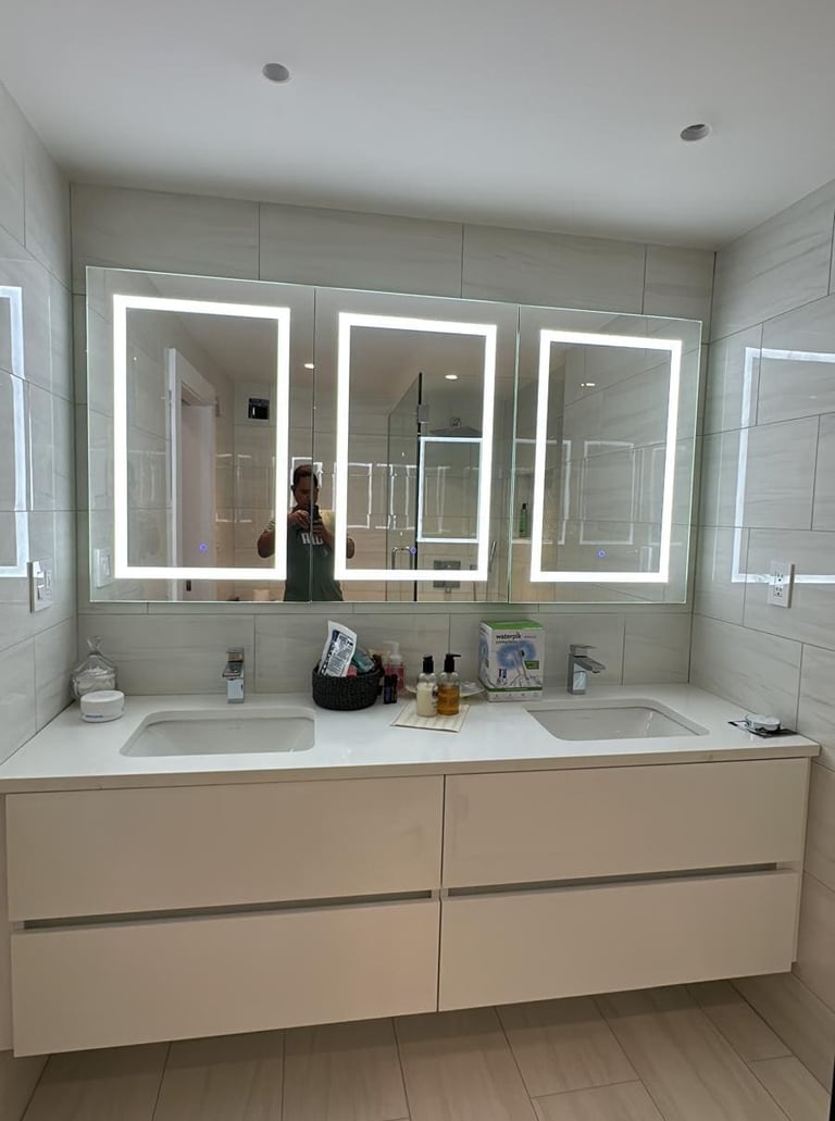 a bathroom with a mirror and a mirror
