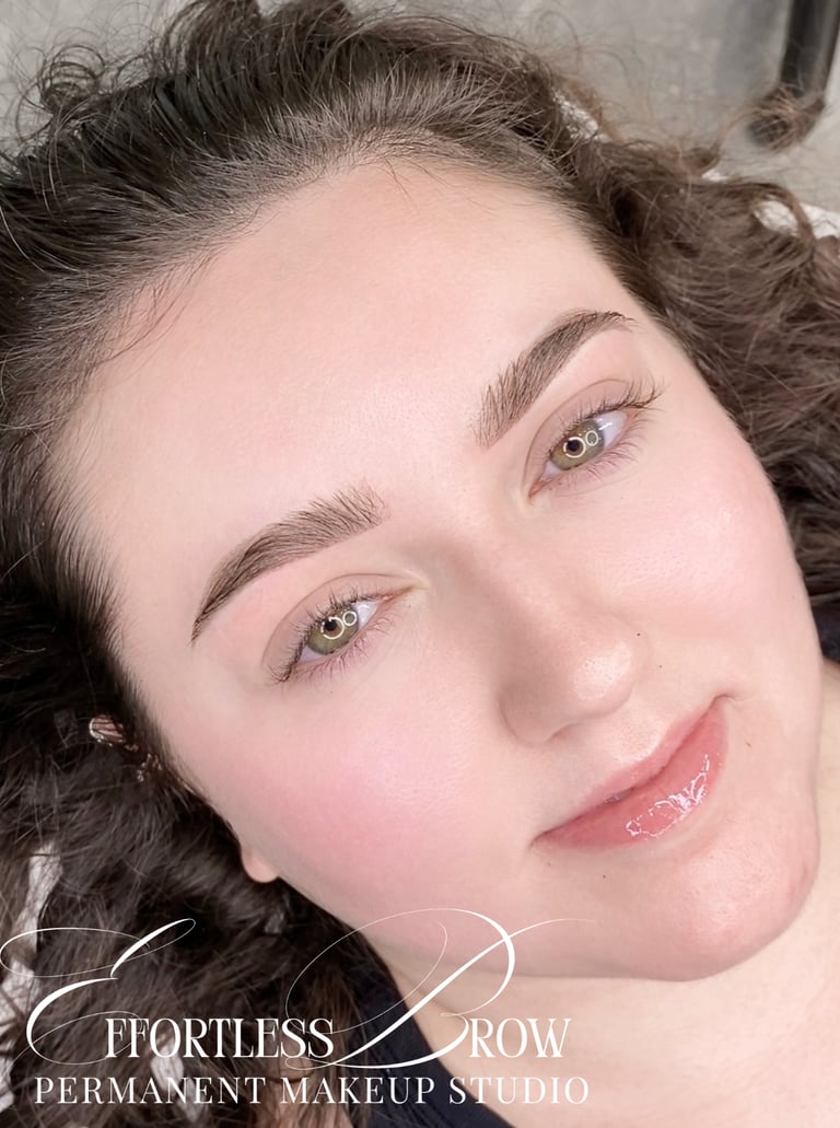 A view of symmetrical and softly defined ombre powder brows immediately after the service.