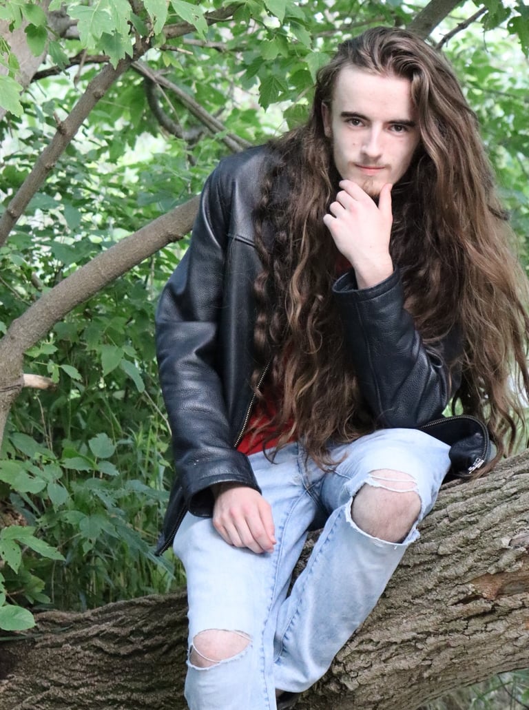 Camus sitting in a tree looking wise and contemplative