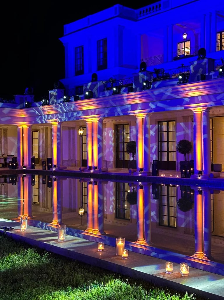 Poolside gala event with blue evening lighting
