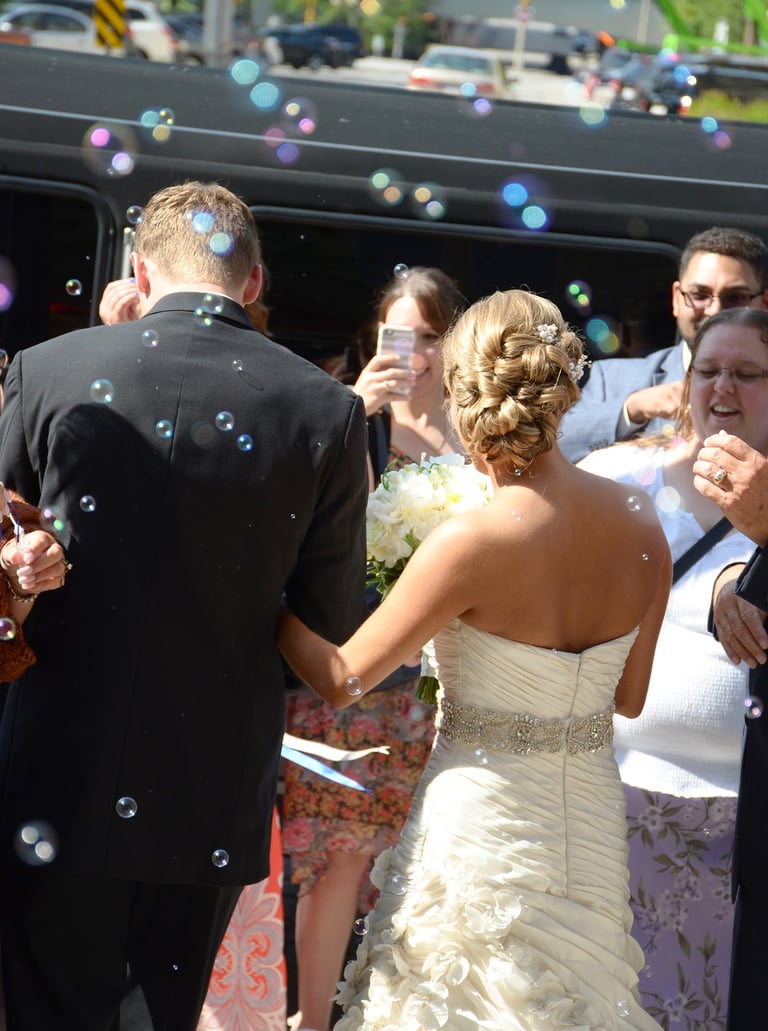 a bride and groom are walking down the aisle