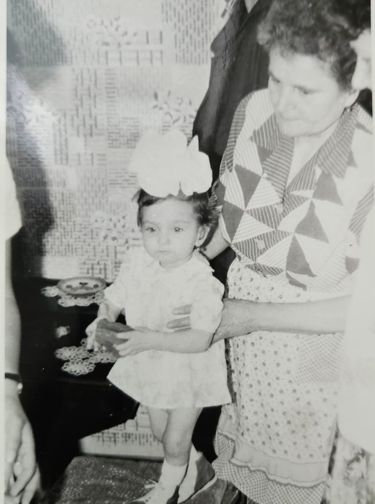 a woman holding a toddler 