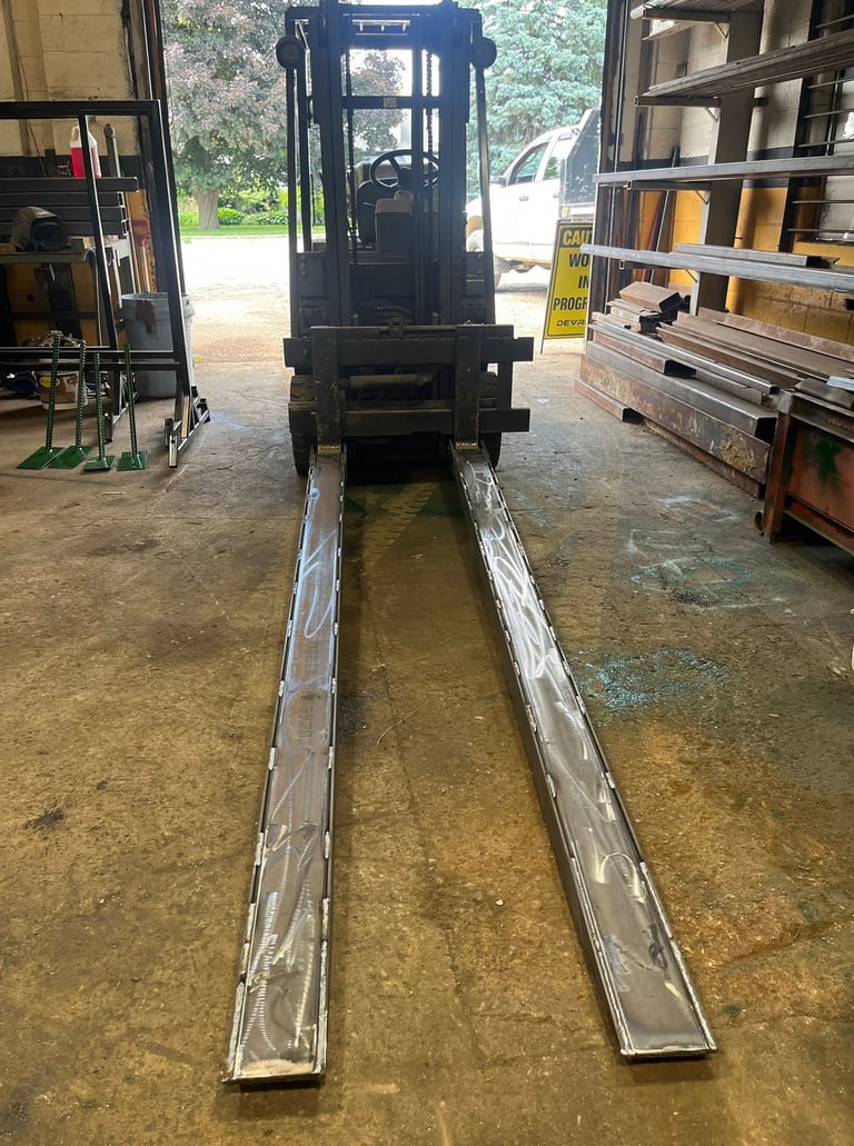 fork lift fork extensions displayed on fork lift