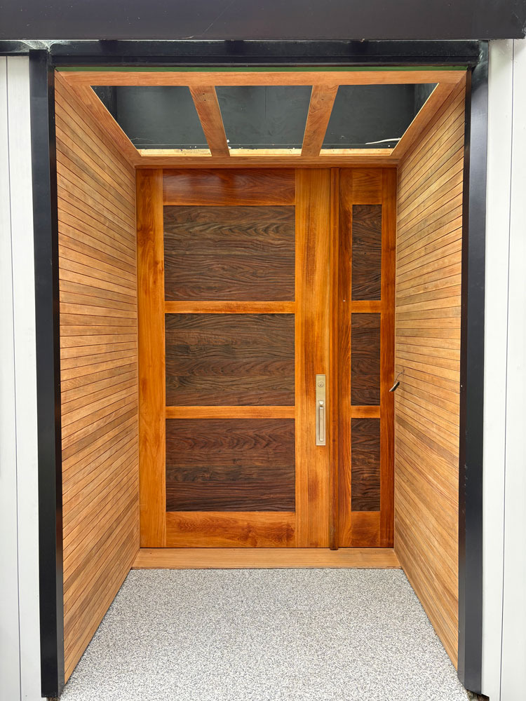 During image of stain refinishing on Nanoose Bay entrance way