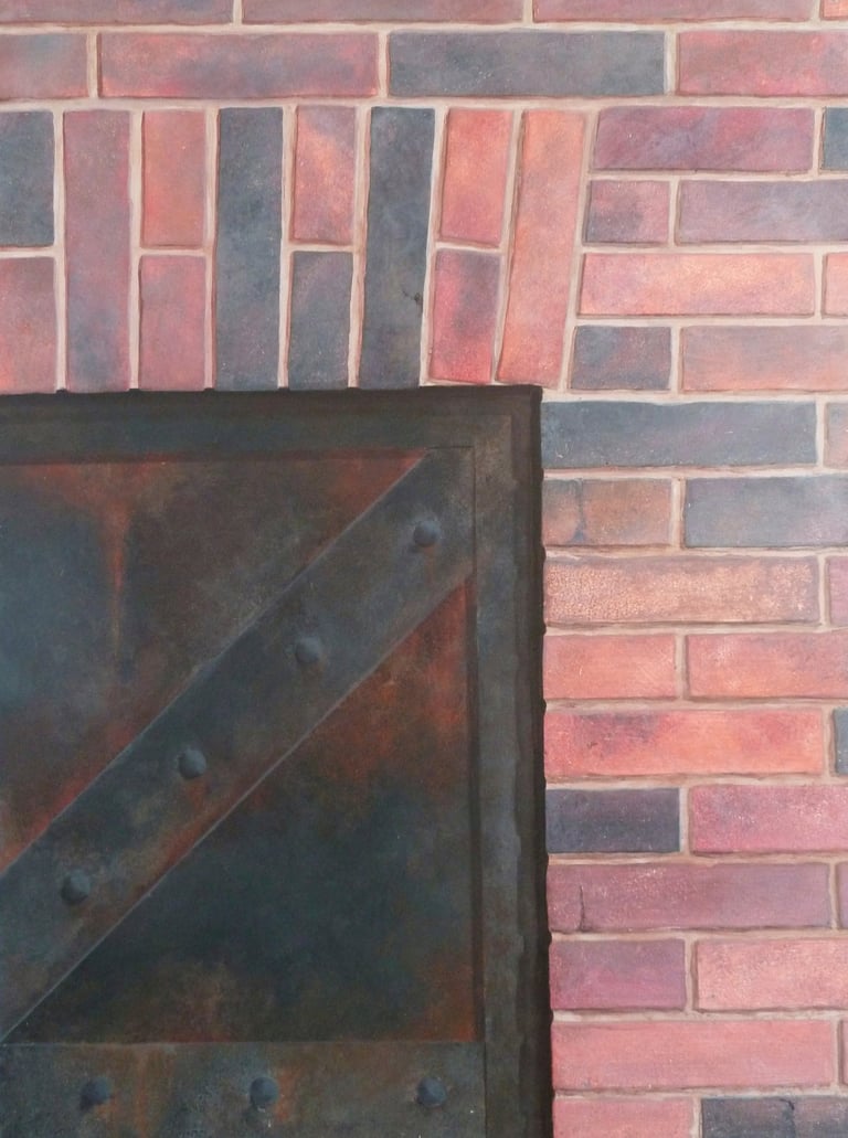 Décor peint en trompe-l'oeil, une porte rivetée en métal rouillé avec un mur en briques