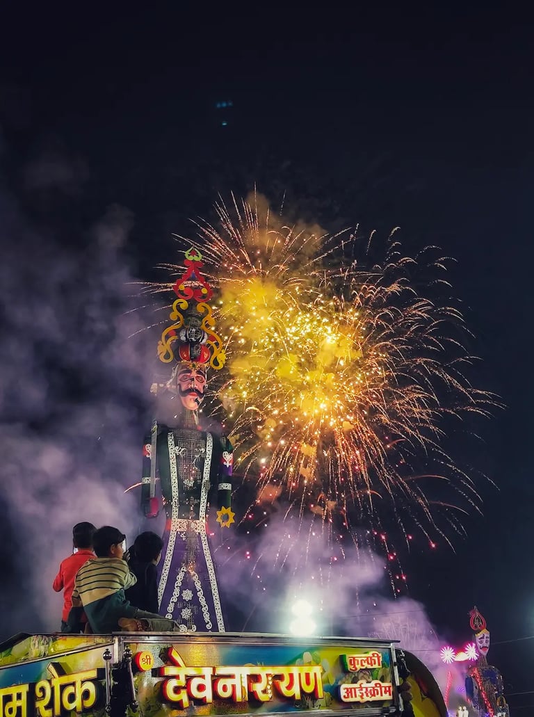 Ravana effigy burning at Kota Dussehra Mela, surrounded by dazzling fireworks lighting up the night sky.