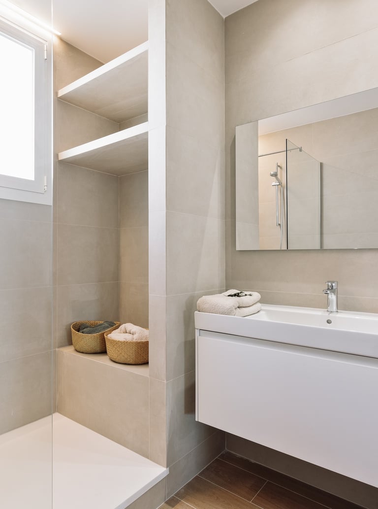 Modern bathroom design with in-built shower and natural stone tiles