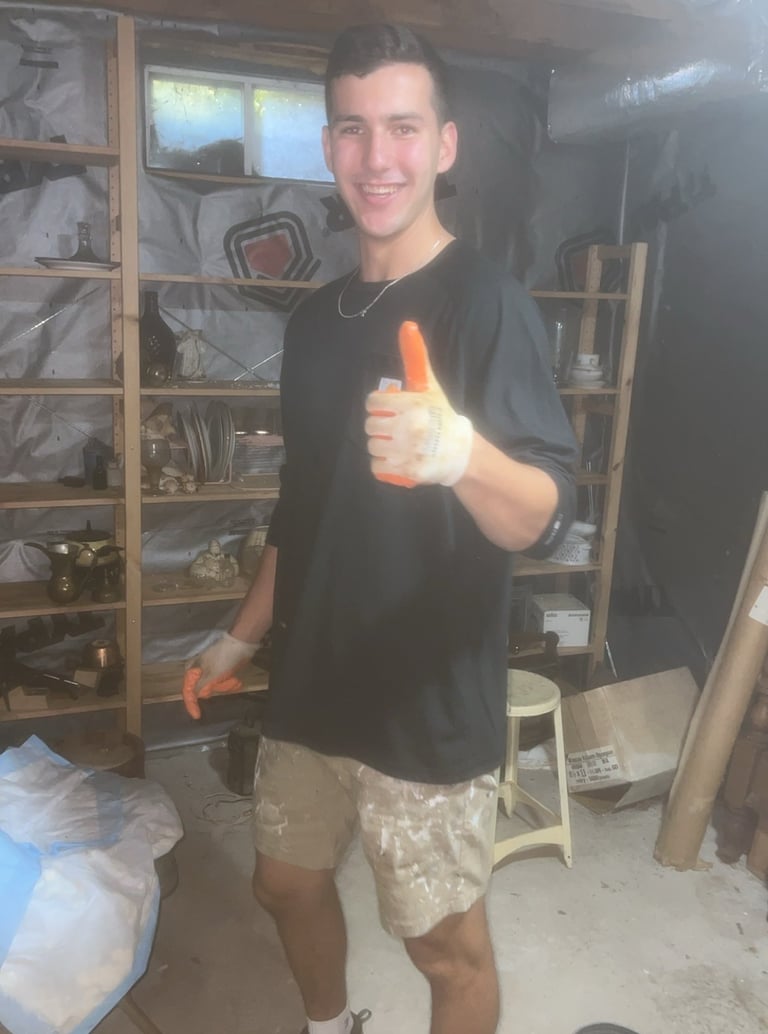 Junk removal crew wearing protective gear during cleanout work