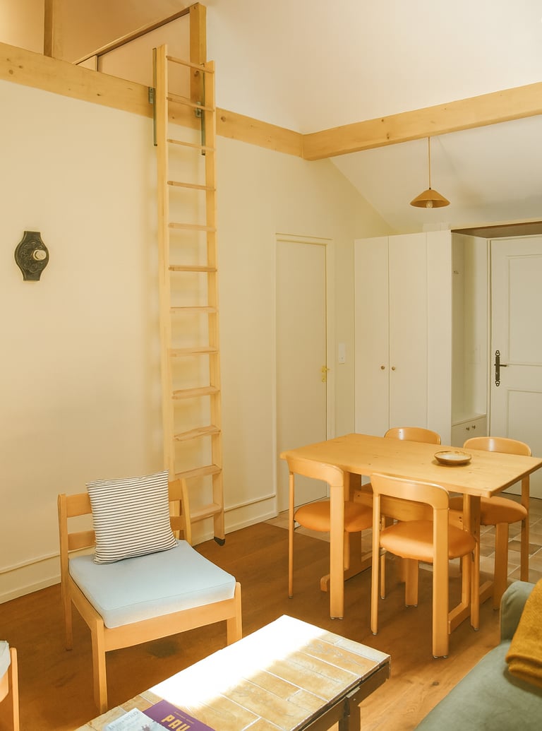 Renovated duplex in Pau with Charlotte Perriand table and Bruno Rey chairs