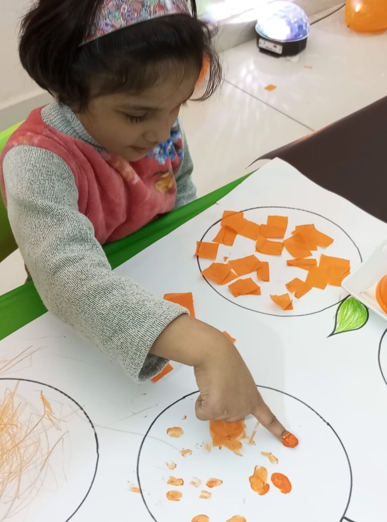Child enjoying tactile play with sensory materials