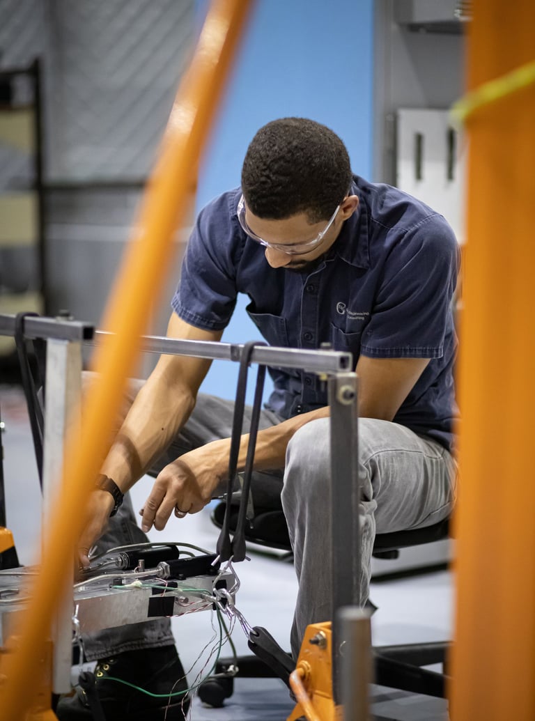 Commercial branding photograph of a technician working on equipment in Tempe, Arizona.