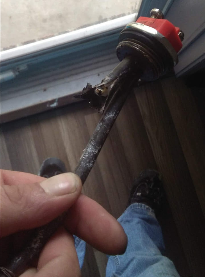 a person holding a small piece of metal in their hand