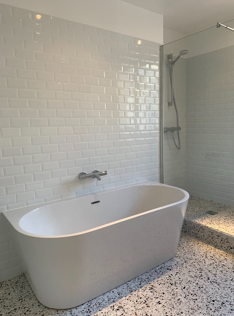 a bathtub with a shower and a shower