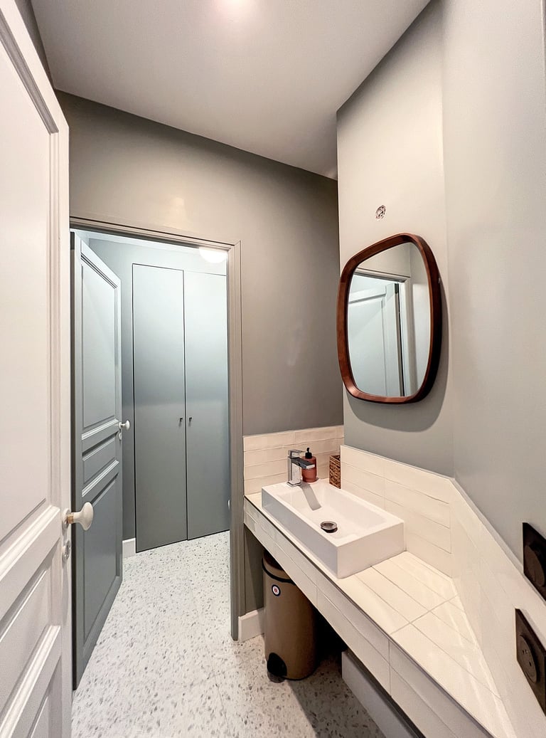 a bathroom with a sink and a mirror