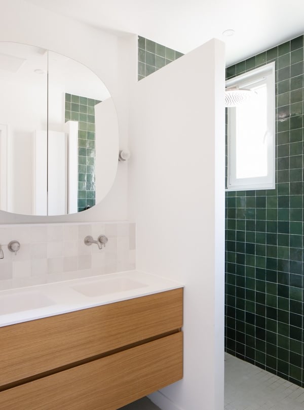 a bathroom with a mirror and a mirror