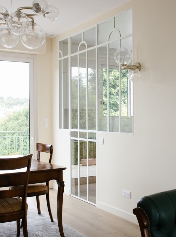 a dining room with a table and chairs