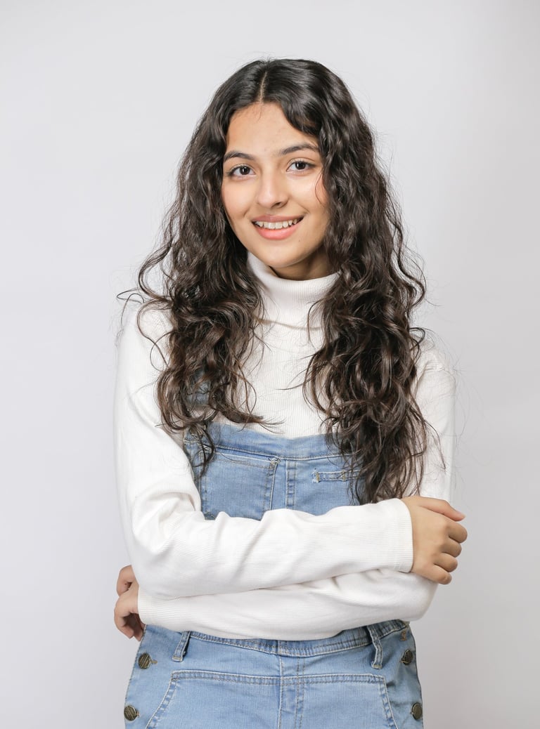 a woman with long hair and a white sweater