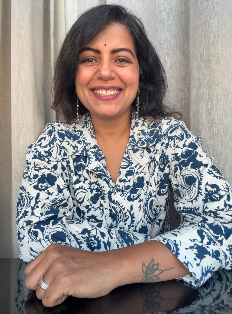 a woman with a tattoo on her arm and a tattoo on her arm