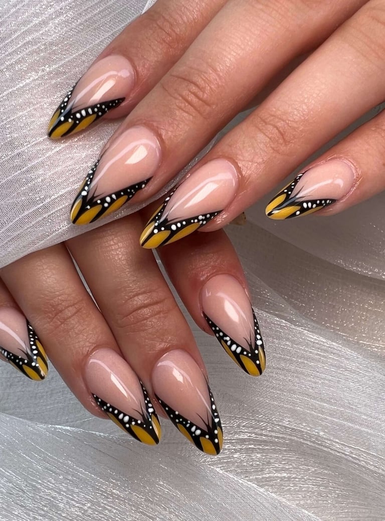 Square fall nails with orange leaf art, gold glitter ombre, and plaid accent designs.