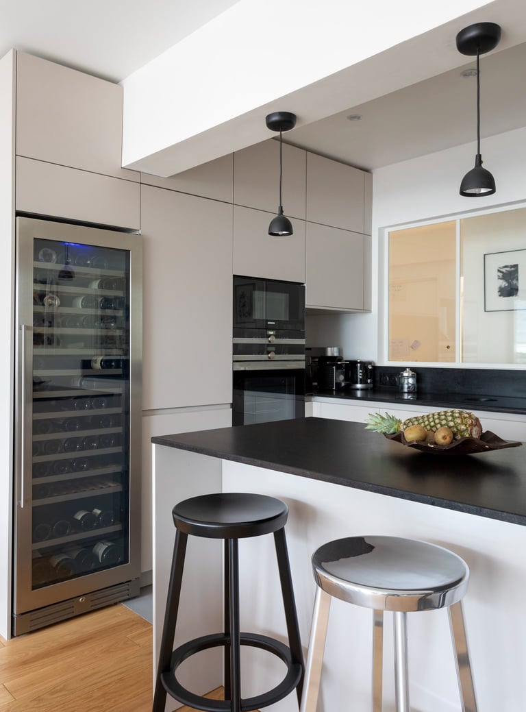 a kitchen with a wine cooler and a wine cooler