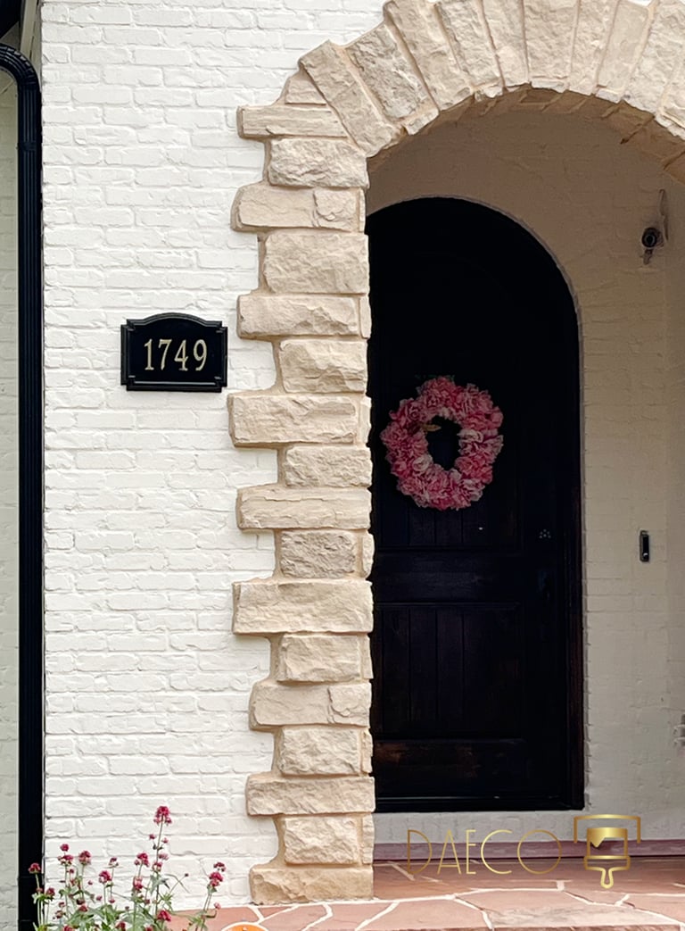 Exterior painting detail of a home in Washington Park, Denver. Features crisp white painted brick c