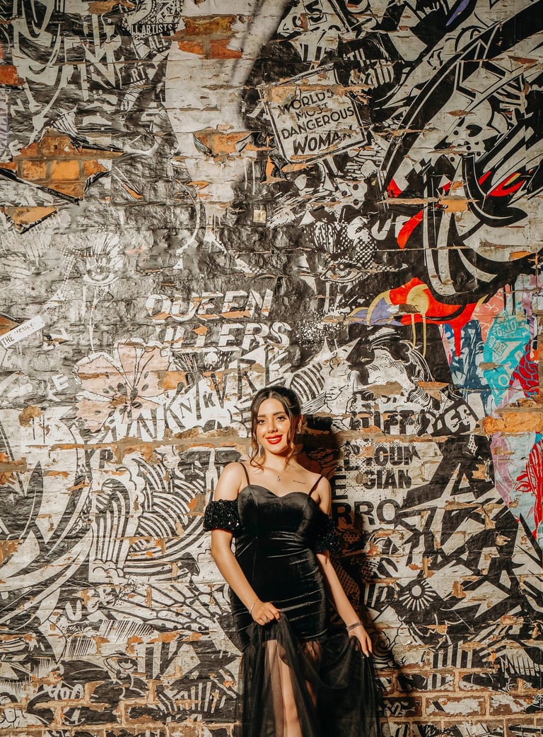Bride posing by a colorful graffiti wall in York’s vibrant streets, captured by Fred Art Studio.