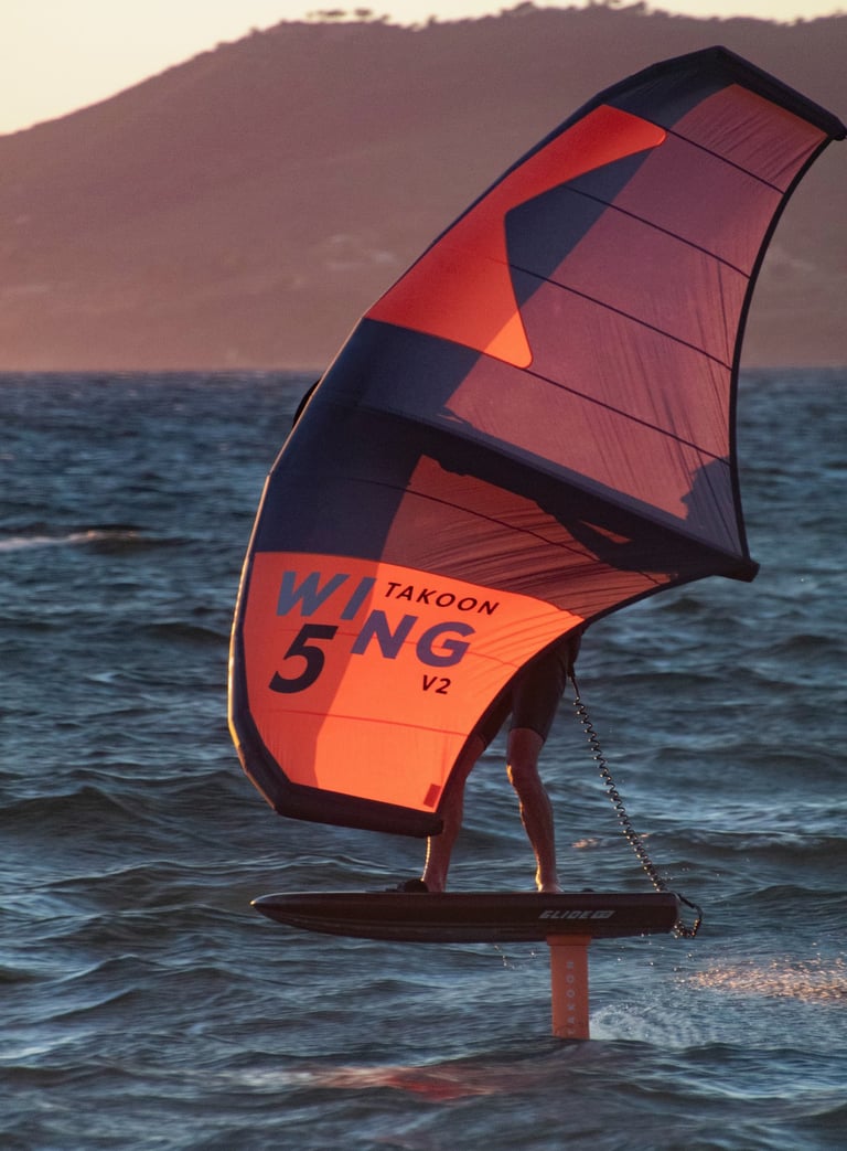 orange Wingfoil during sunset