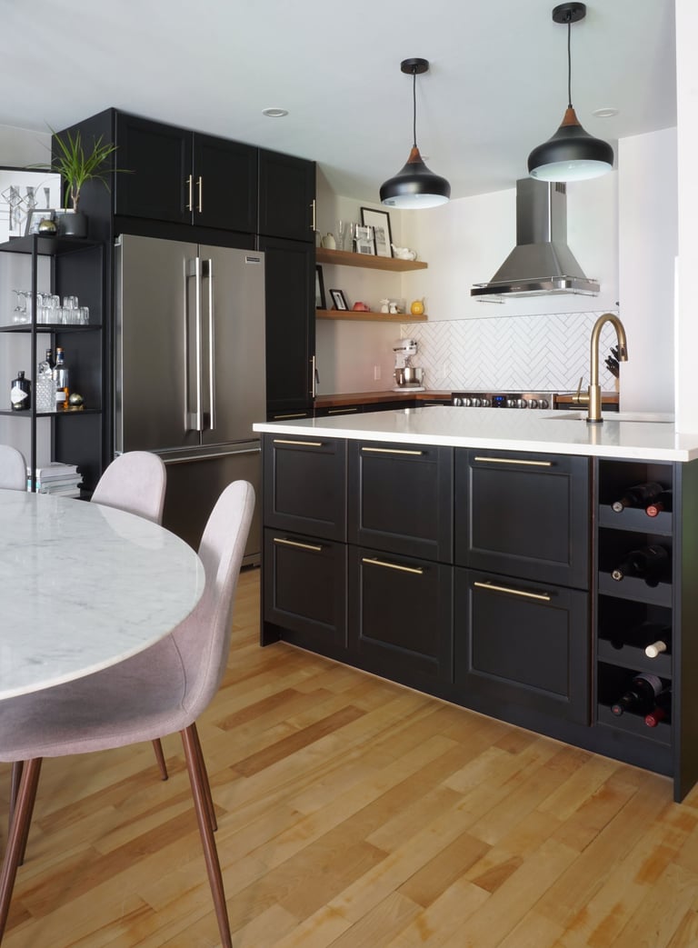 a kitchen with a marble table and chairs