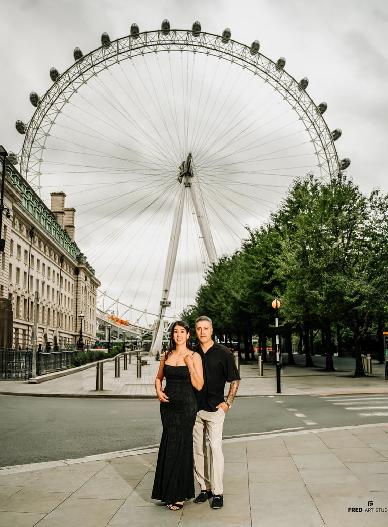Couple standing near the London Eye during their engagement session, captured by Fred Art Studio
