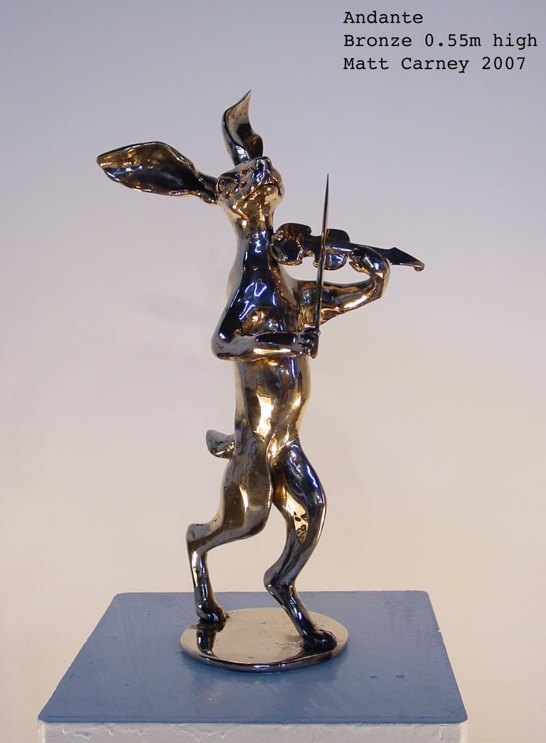a statue of a rabbit playing violin