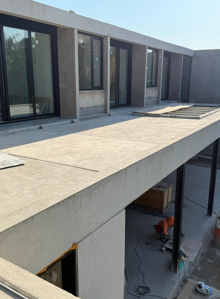 a truck parked in front of a building with a green tarp