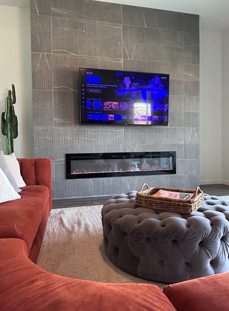 Close-up of mounted TV on tiled fireplace wall with hidden wiring.