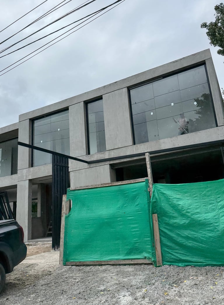 a house being built into a house with a pool and a pool