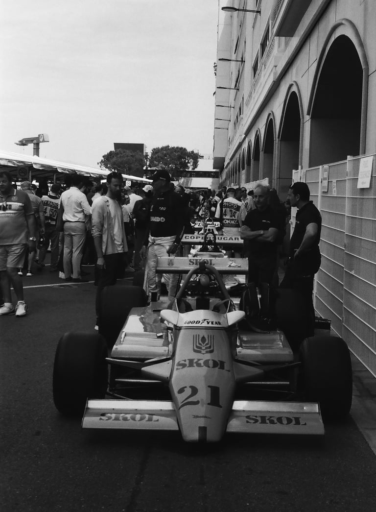 a race car parked in the paddock