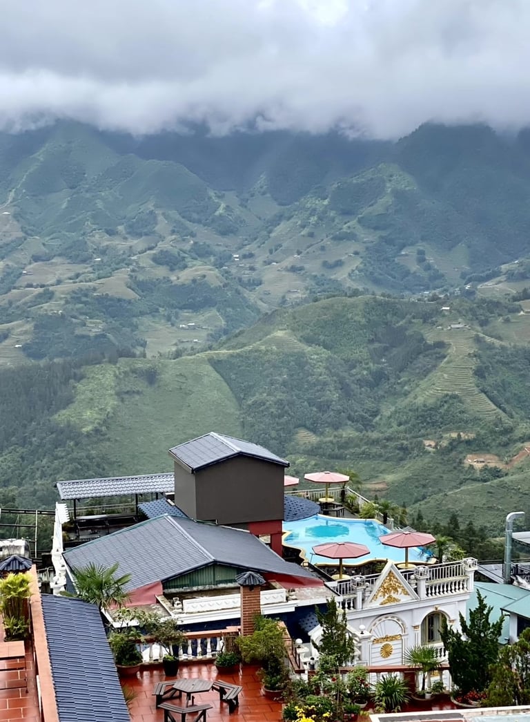a view of a mountain range with a pool