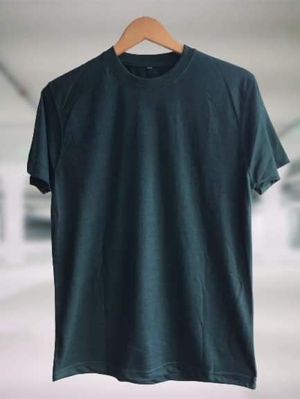 a green t-shirt dispalyed on a hanger