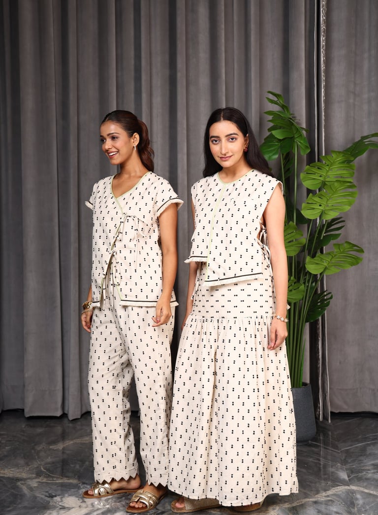 two women in matching polka dotty outfits