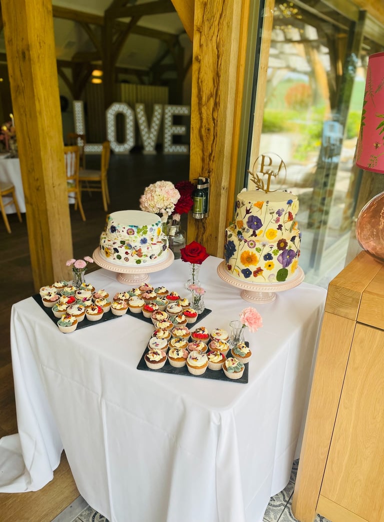 floral wedding cake and dessert table