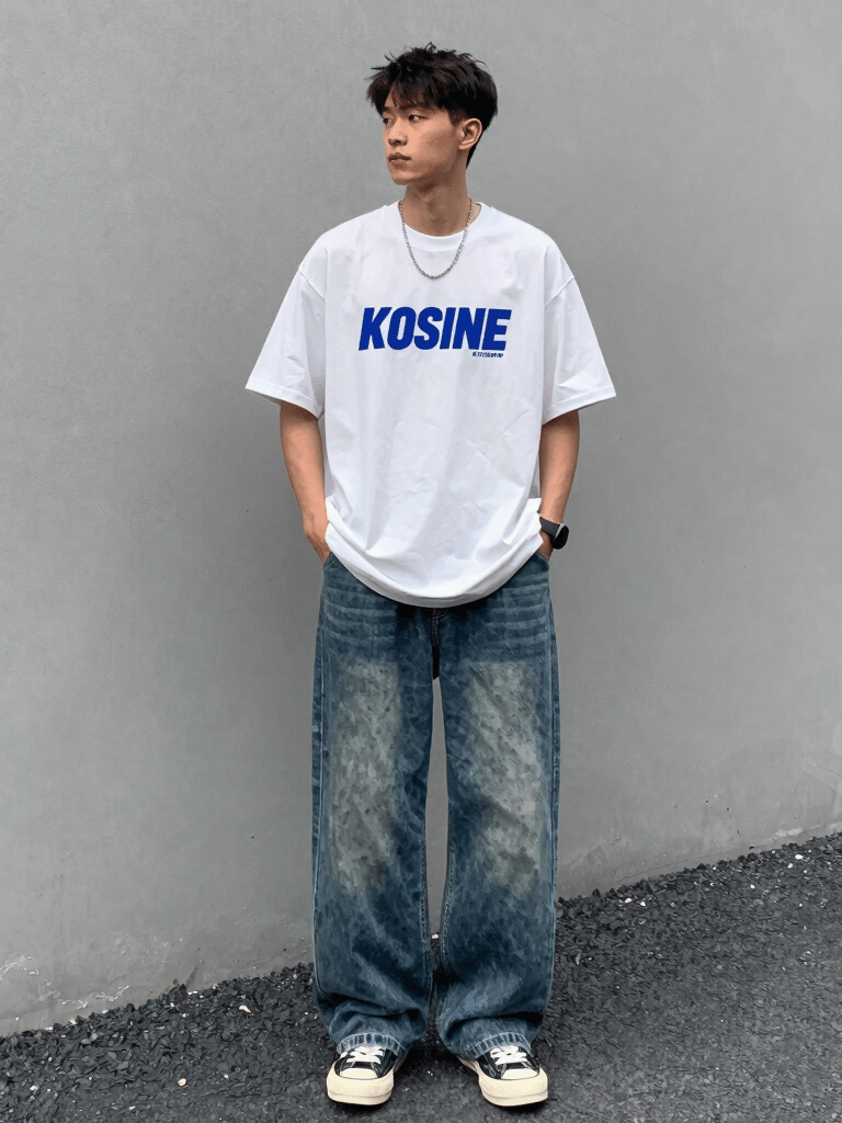 A stylish young man wearing a crisp, trendy shirt standing confidently in an urban setting.