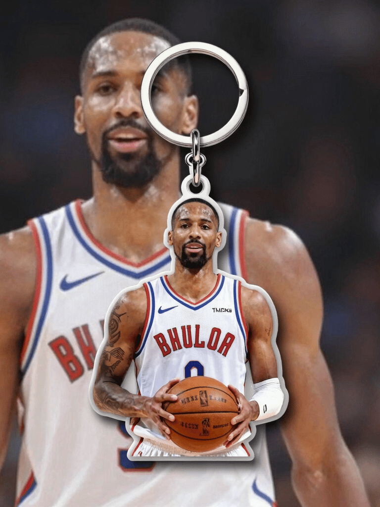 Colorful customized PVC and acrylic keychains hanging from a mint-green background