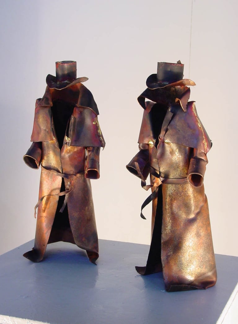 two metal sculptures of bushrangers