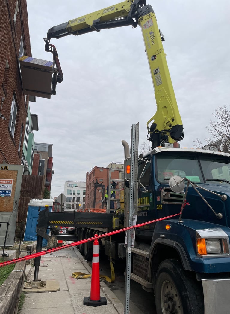 a crane truck with a crane on it's side