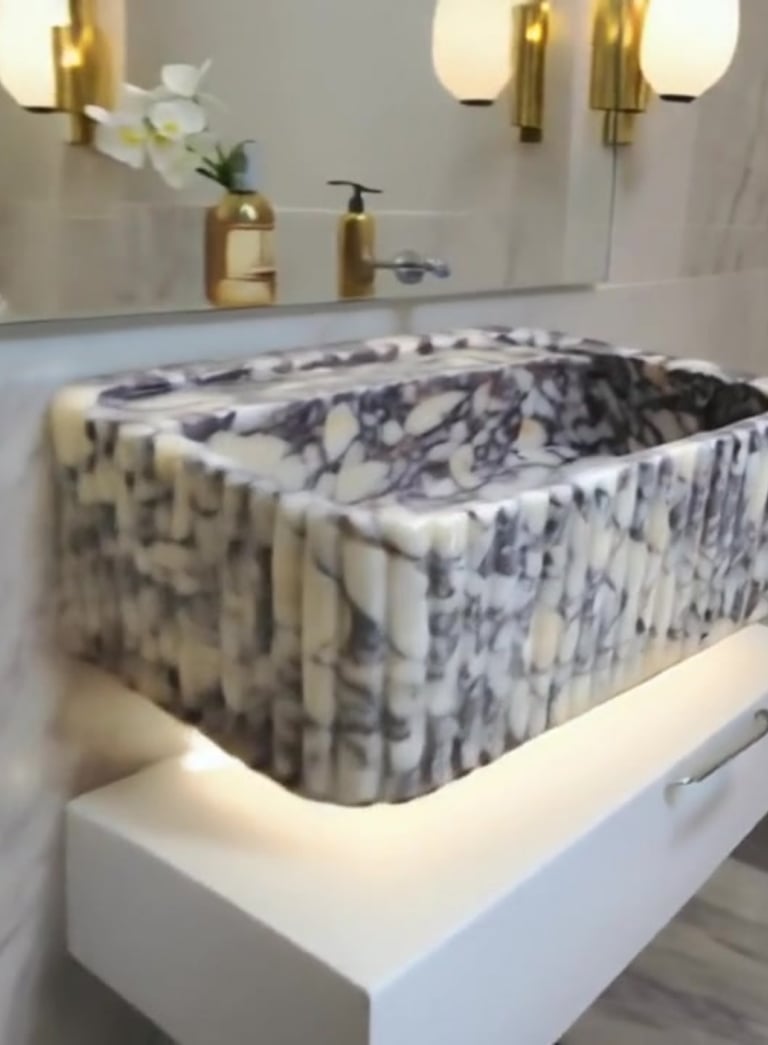 A bathroom sink with a marble sink