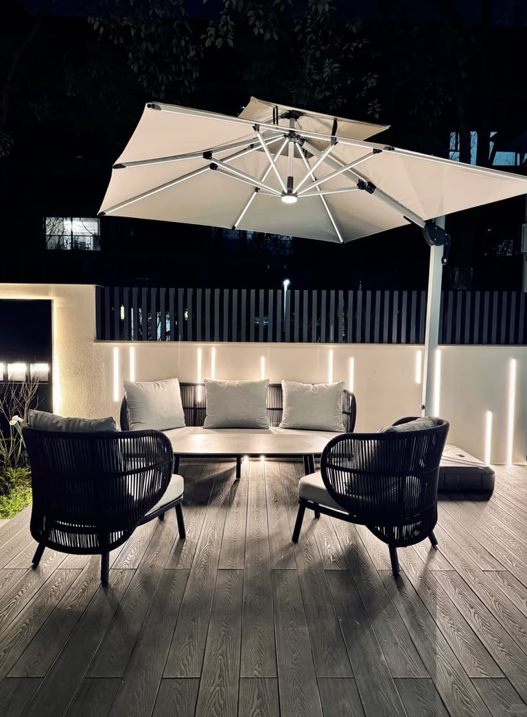 Cozy outdoor lounge area with umbrella and ambient lighting.