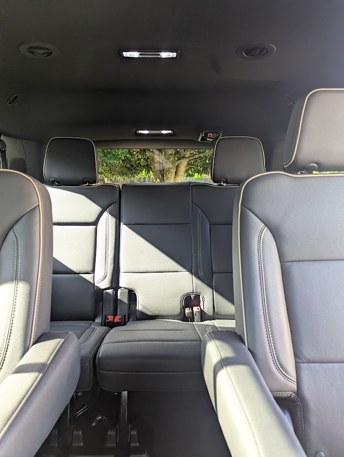 Interior view of a modern SUV showing gray leather car seats with premium stitching.